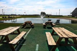 Outdoor seating area and fire pit at Sunset View RV Resort with resort-style amenities